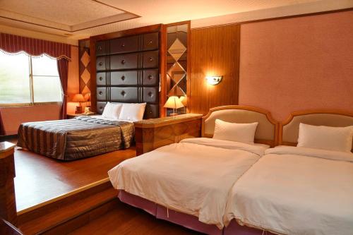 Postel nebo postele na pokoji v ubytování Love Boat Motel