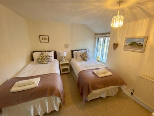 Katil atau katil-katil dalam bilik di Jubilee Cottage