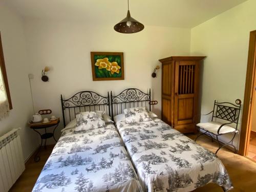 Ένα ή περισσότερα κρεβάτια σε δωμάτιο στο Casa Rural Era de Ferro