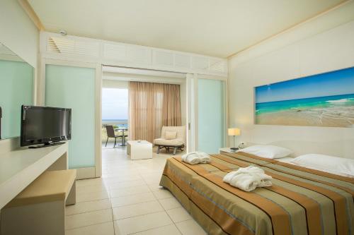 A television and/or entertainment centre at Lindos White Hotel & Suites