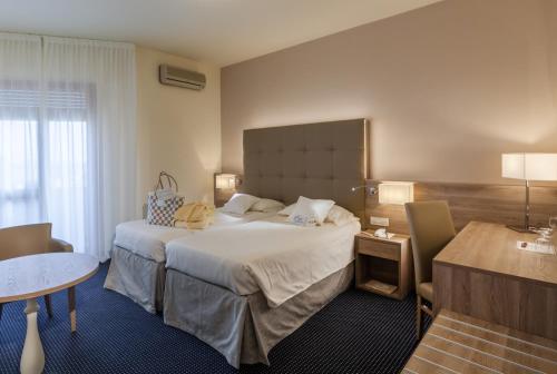 Postel nebo postele na pokoji v ubytování Hotel Garden Terme