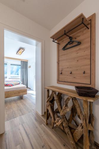 a bedroom with a table and a bed in a room at Appartements Bergwelt in Oetz