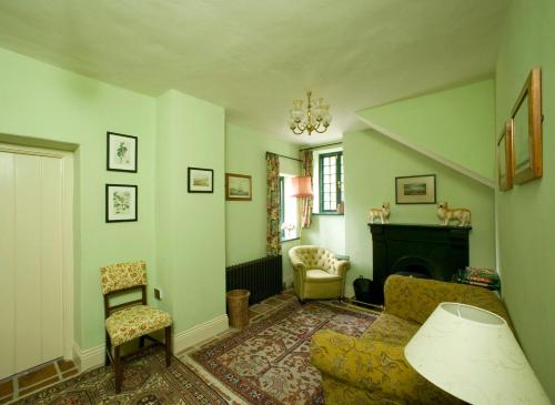 a living room with a couch and a fireplace at Castletown Gate House in Celbridge