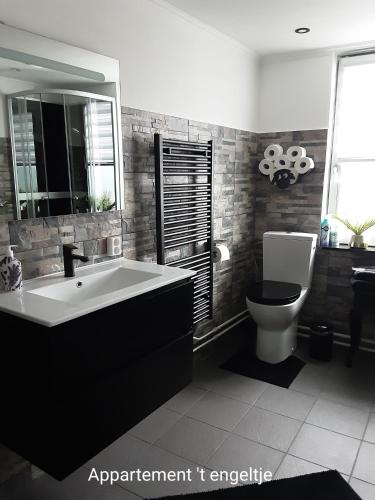 a bathroom with a large tub and a toilet at D'n Engel in Sittard