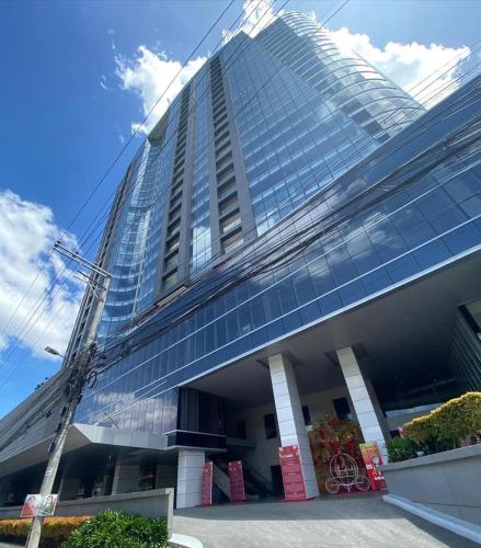 a large building with a lot of windows at Condotel Aeon Towers Davao 20mbps Wifi in Davao City
