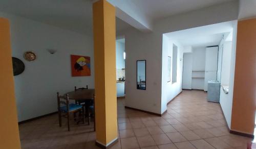 a living room with a table and a dining room at Miralago Casa in Menaggio