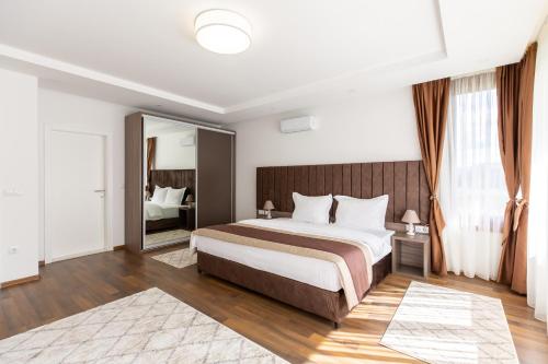 Postel nebo postele na pokoji v ubytování Malak Resort Sarajevo
