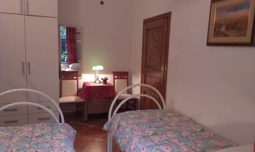 a room with a bed and a table and chairs at Apartment City Garden in Kotor