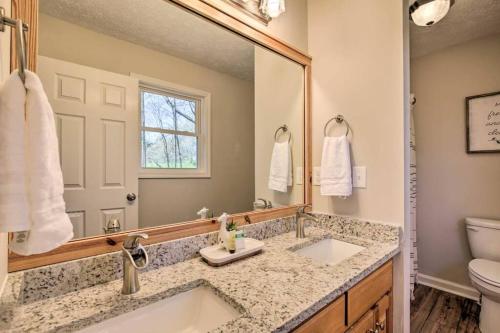 A bathroom at Less than 3 miles to Downtown with firepit