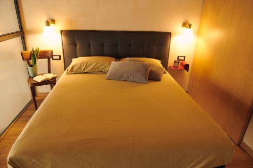 Säng eller sängar i ett rum på DADA home, Loft di 38 Mq tra Napoli e Pompei