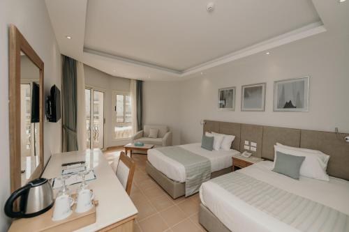Letto o letti in una camera di Sunrise Aqua Joy Resort