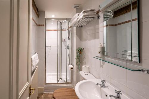 a bathroom with a sink and a shower at Bowl Inn in Almondsbury