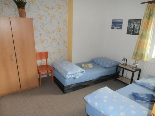 Katil atau katil-katil dalam bilik di Ubytování Svatá Trojice