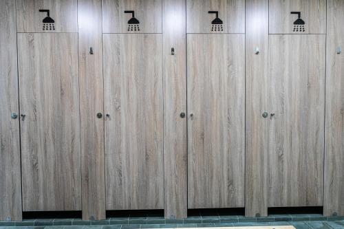 a row of wooden lockers in a gym at Futurotel Malagueta Beach in Málaga