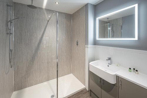 a bathroom with a shower and a sink at The Townhouse Aberfeldy in Aberfeldy