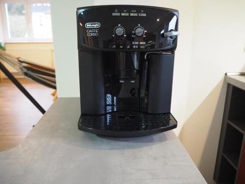 a coffee maker sitting on top of a counter at Kaffeevollautomat, Hängematte & Netflix, zentral in Idar-Oberstein