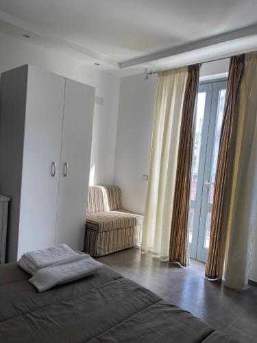 Postel nebo postele na pokoji v ubytování APPARTAMENTI IL VENTAGLIO