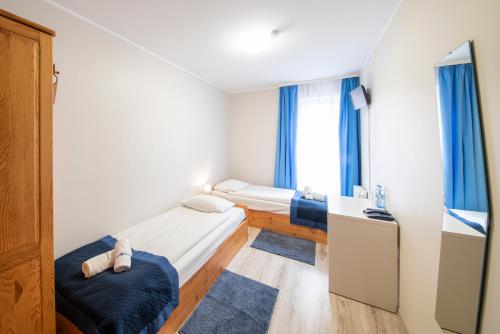 Katil atau katil-katil dalam bilik di Hotel Nowa Panorama