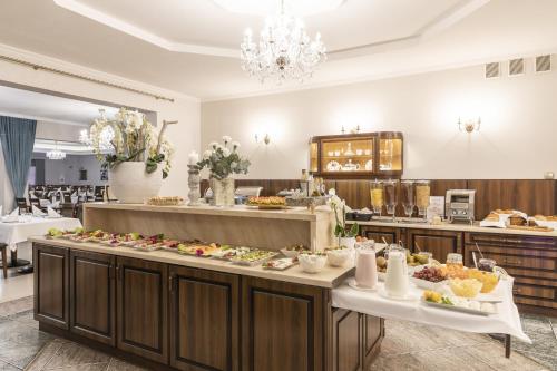 a buffet line with many different types of food at BURSZTYN - BERNSTEIN APARTMENTS in Dąbki