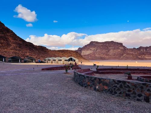 a view of a beach with mountains in the background at Shakria Bedouin Life Camp in Wadi Rum