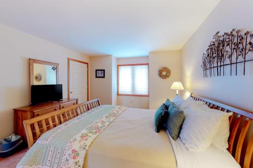 a bedroom with a large bed and a television at Locke Mountain D1 in Newry