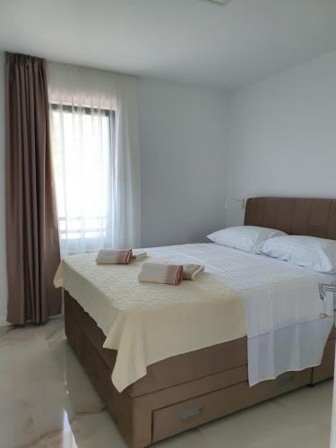 Postel nebo postele na pokoji v ubytování Bellissima Apartments
