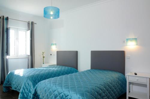 Ένα ή περισσότερα κρεβάτια σε δωμάτιο στο Corvos e Cadavais
