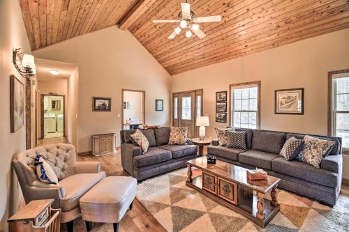 a living room with couches and a wooden ceiling at Pet-Friendly Abingdon Abode with Yard and Grill! in Abingdon