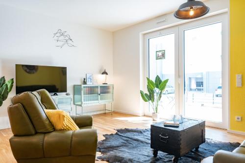 Ruang duduk di Moderne Neubauwohnung bei Köln