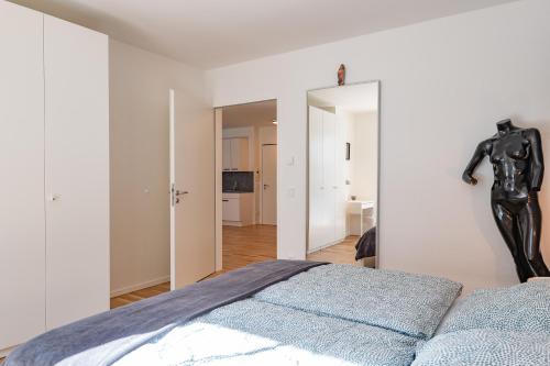 Una cama o camas en una habitación de Moderne Neubauwohnung bei Köln