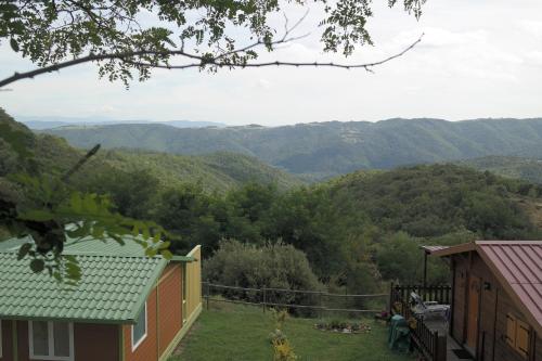 a view of the mountains from a house at Domaine Plein Sud in Bruzac