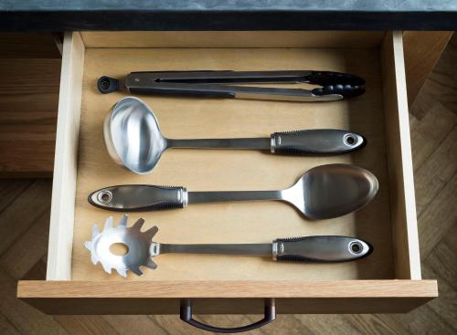 a wooden box with four utensils in it at ROOST Midtown in Philadelphia