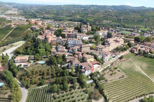 an aerial view of a town with vineyards at Casa Caimotta in Neive