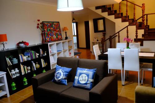 a living room with a couch and a table at Apartamento Alegria in Arouca