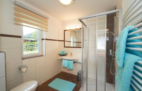 a bathroom with a shower and a sink at Appartements Bergblick in Flachau