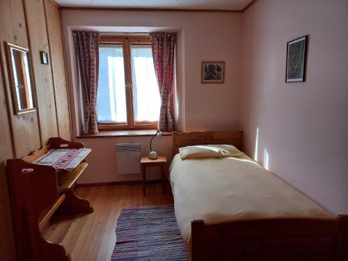 Postel nebo postele na pokoji v ubytování Casa Vacanza Ponte Aino