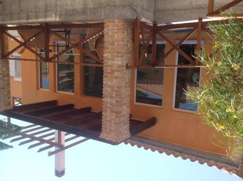 a building with windows and a brick pillar at Boutique Hotel Ileas Village in Arkoudi