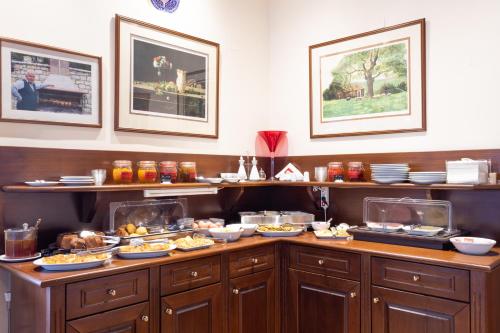 a buffet line with many plates of food at Konitsa Mountain Hotel in Konitsa