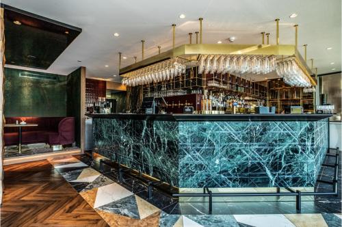 a bar with a blue marble counter in a restaurant at Van der Valk Hotel Breda in Breda