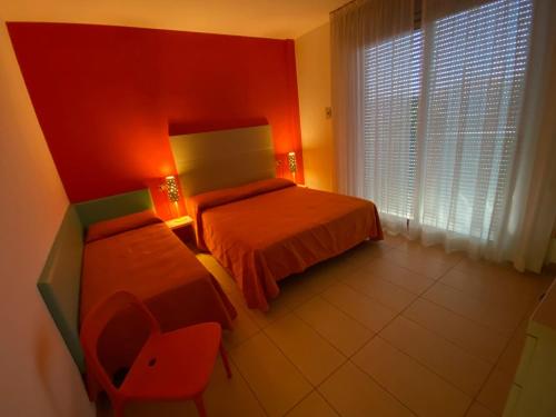 Giường trong phòng chung tại Residenza Villa Flores