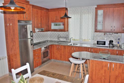 Köök või kööginurk majutusasutuses River Home Ponteceso