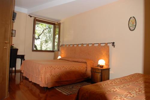 Posteľ alebo postele v izbe v ubytovaní Locanda dei Rii