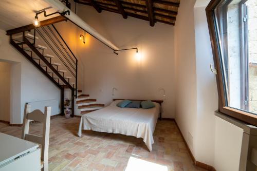 Кровать или кровати в номере La Residenza dei Priori