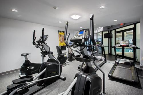a gym with several treadmills and elliptical machines at Crowne Plaza Providence-Warwick (Airport) by IHG in Warwick
