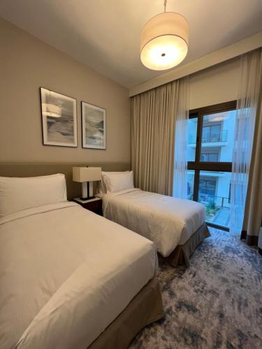 Posteľ alebo postele v izbe v ubytovaní Apartment Fujairah