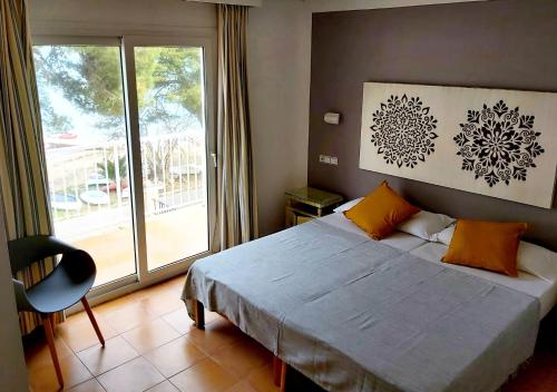 Katil atau katil-katil dalam bilik di Hostal Bahía Azul