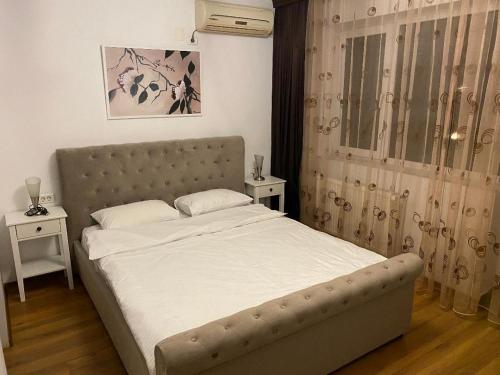 Un pat sau paturi într-o cameră la Vila Lucian