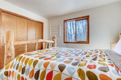 a bedroom with a large bed and a window at Lovely and Comfy Cabin Surrounded by Aspens and Wildlife - Aspen Acres in Fairplay