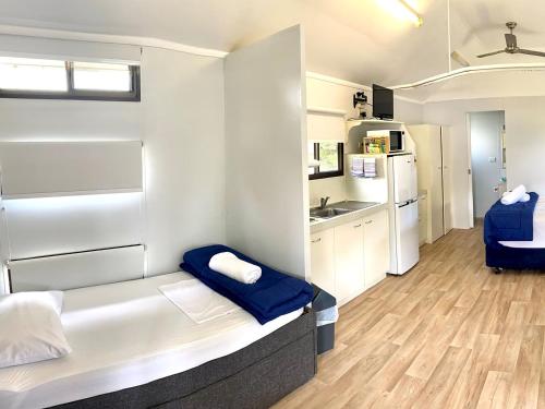 a hotel room with a bed and a desk at NRMA Woodgate Beach Holiday Park in Woodgate