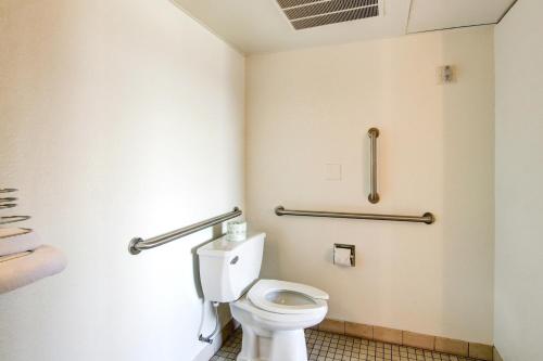 a bathroom with a toilet in a room at Motel 6-Denver, CO - Airport in Denver